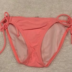 Hot pink bikini bottom with strings on sides